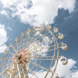 Low angle view of ferris wheel against sky