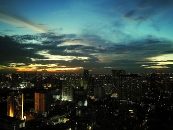 Aerial view of city lit up at night