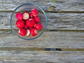 High angle view of strawberries in bowl on table