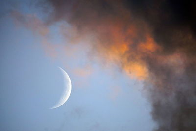 Low angle view of moon in sky at night