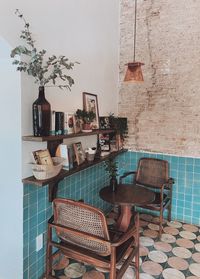 Empty chairs and tables against wall at home