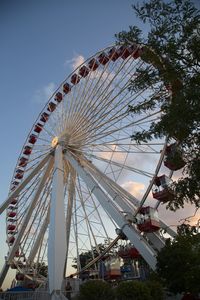 Low angle view of ferris wheel against sky