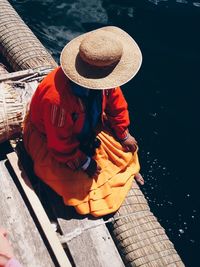 High angle view of man with hat in water