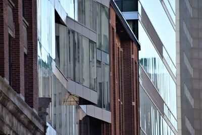 Low angle view of modern buildings against sky