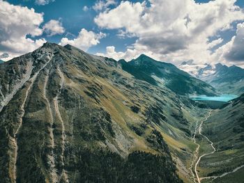 Panoramic view of mountains against cloudy sky