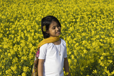 Full length of girl standing on field