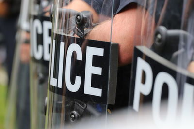 Police riot shields during protest, selective focus