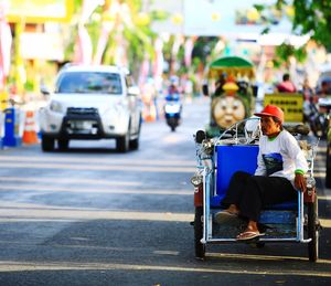 Man sitting on city street