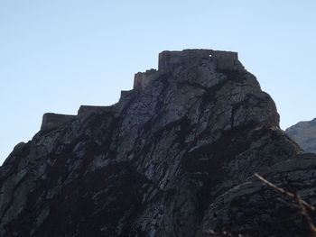 Low angle view of rock formation against sky