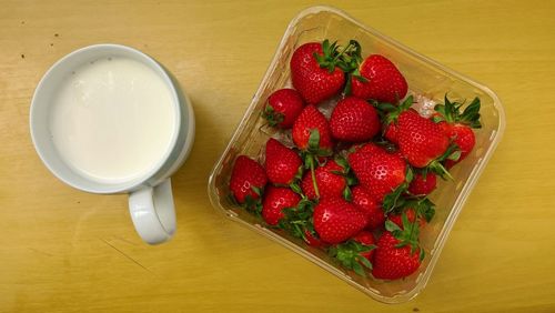 High angle view of strawberries in bowl on table