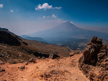 Panoramic view of arid landscape against sky