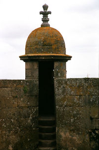 Stone structure against sky