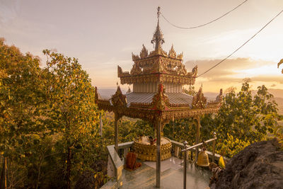 Panoramic view of temple building against sky during sunset