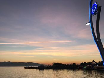 Scenic view of river against sky during sunset