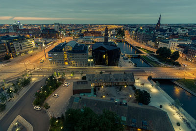 High angle view of illuminated cityscape against sky