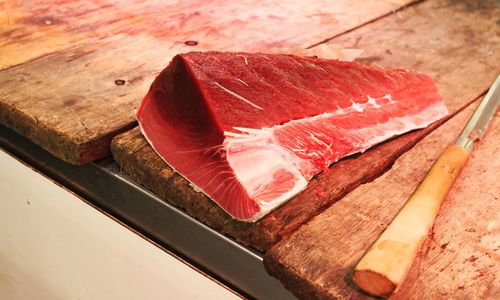 Close-up of raw meat on cutting board