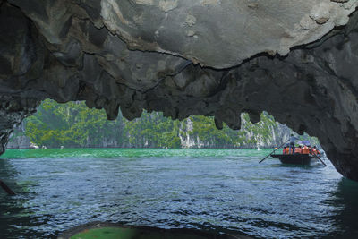 Scenic view of sea seen through cave