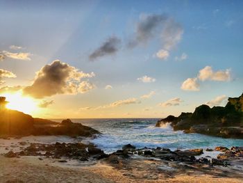 Scenic view of beach at sunset