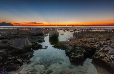 Scenic view of sea against sky during sunset