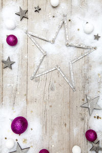 High angle view of decoration on fake snow over table