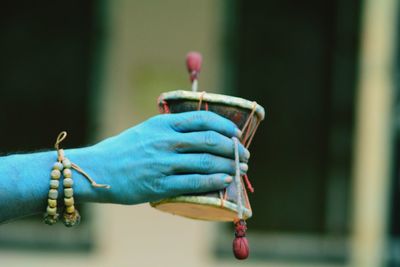 Close-up of hand holding ice cream