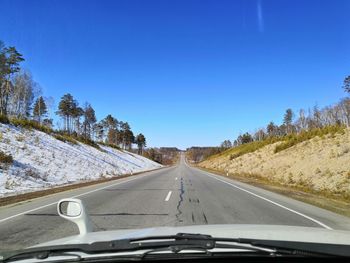 Road seen through car windshield