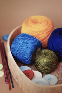 Close-up of multi colored balls of wool on table