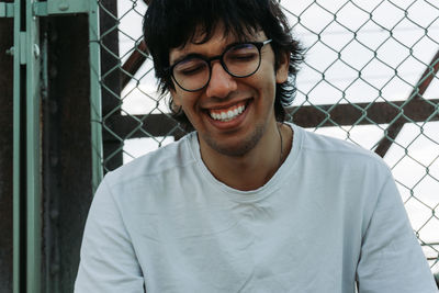 Close-up of young man smiling outdoors