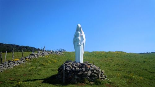 Built structure on land against clear blue sky