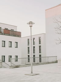 Street by building against clear sky