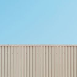 Low angle view of built structure against clear blue sky