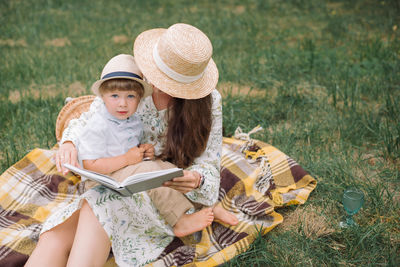 Mother and girl on field