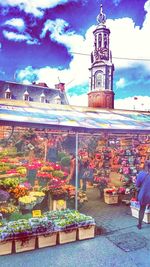 People against cloudy sky