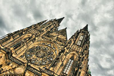 Low angle view of temple building against cloudy sky