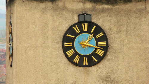 Close-up of clock on wall