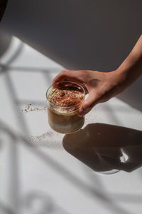 Cropped hand of person holding food