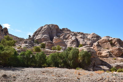 Rock formations on landscape against clear sky