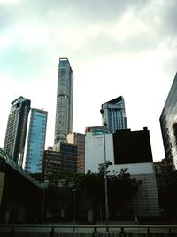 Low angle view of buildings against sky in city