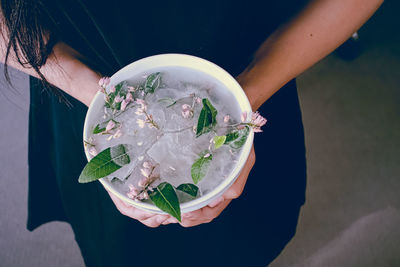 High angle view of woman holding ice cream