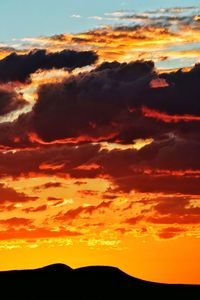 Silhouette of landscape against dramatic sky