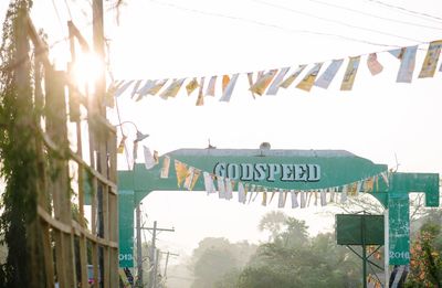 Tilt image of flags hanging against sky