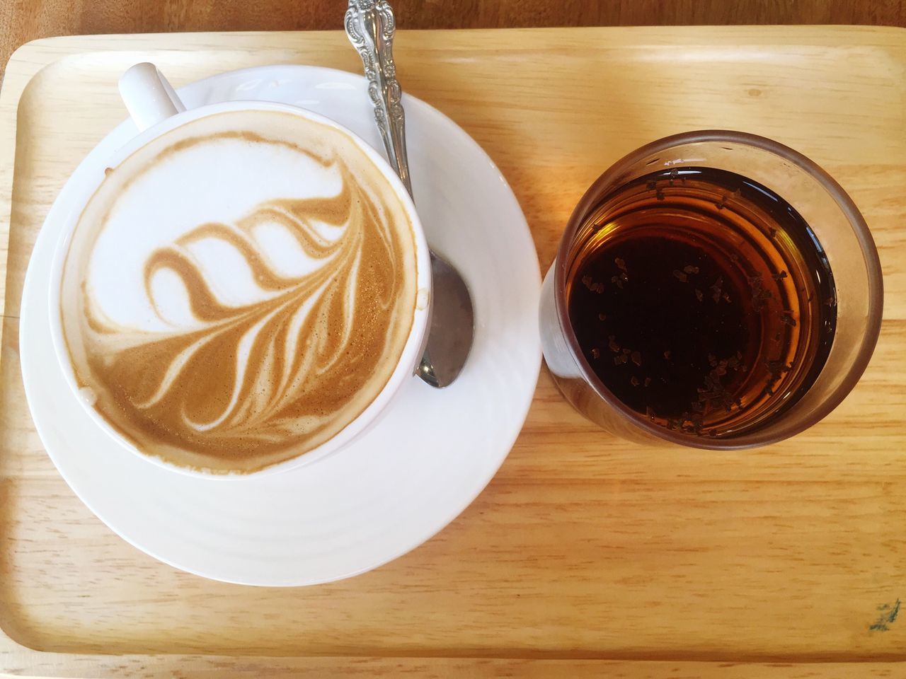 drink, food and drink, refreshment, table, coffee cup, coffee - drink, indoors, freshness, frothy drink, saucer, still life, cappuccino, coffee, froth art, high angle view, close-up, cup, beverage, wood - material, drinking glass