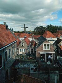 Houses in town against sky