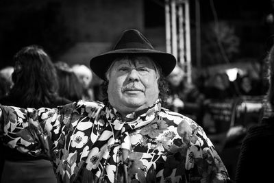 Portrait of man wearing hat standing outdoors