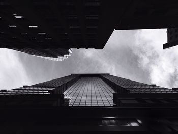 Directly below shot of skyscrapers against sky at wall street