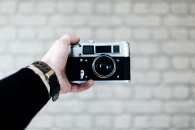 Close-up of hand holding camera