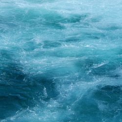 Full frame shot of the swirling water of the waikato river taken near the huka falls, taupo, nz.