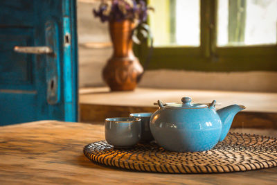 Close-up of tea cup on table at home