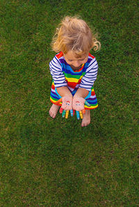 High angle view of cute girl playing on field
