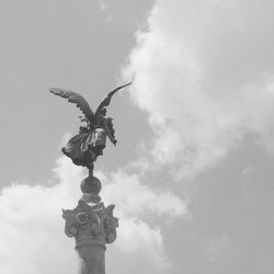 Low angle view of statue against sky